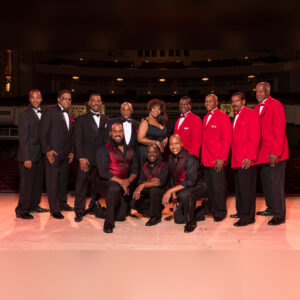 Members of The Drifters, The Platters, and The Coasters all assembled together on stage.