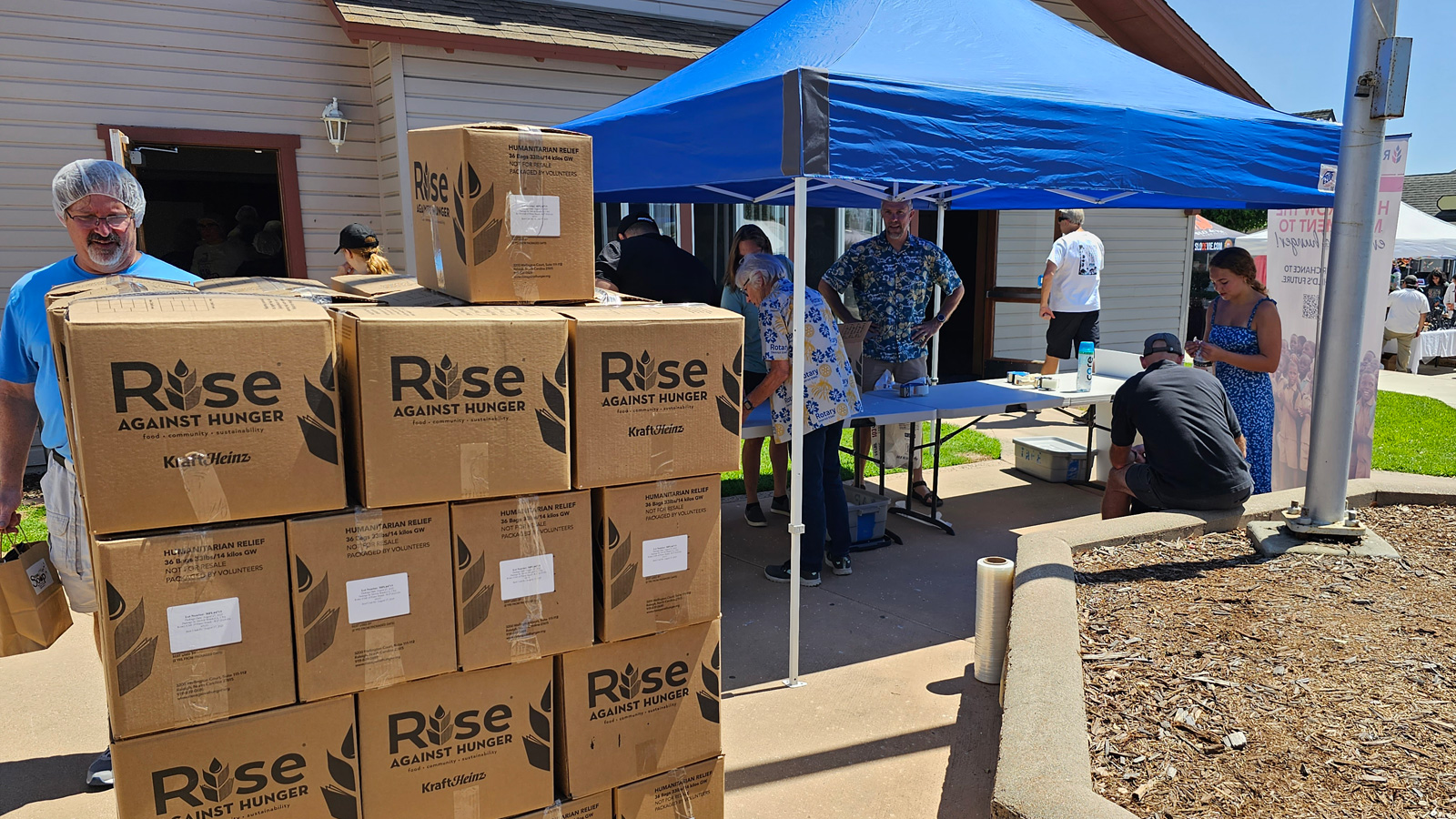 Boxes stacked for Rise Against Hunger event.