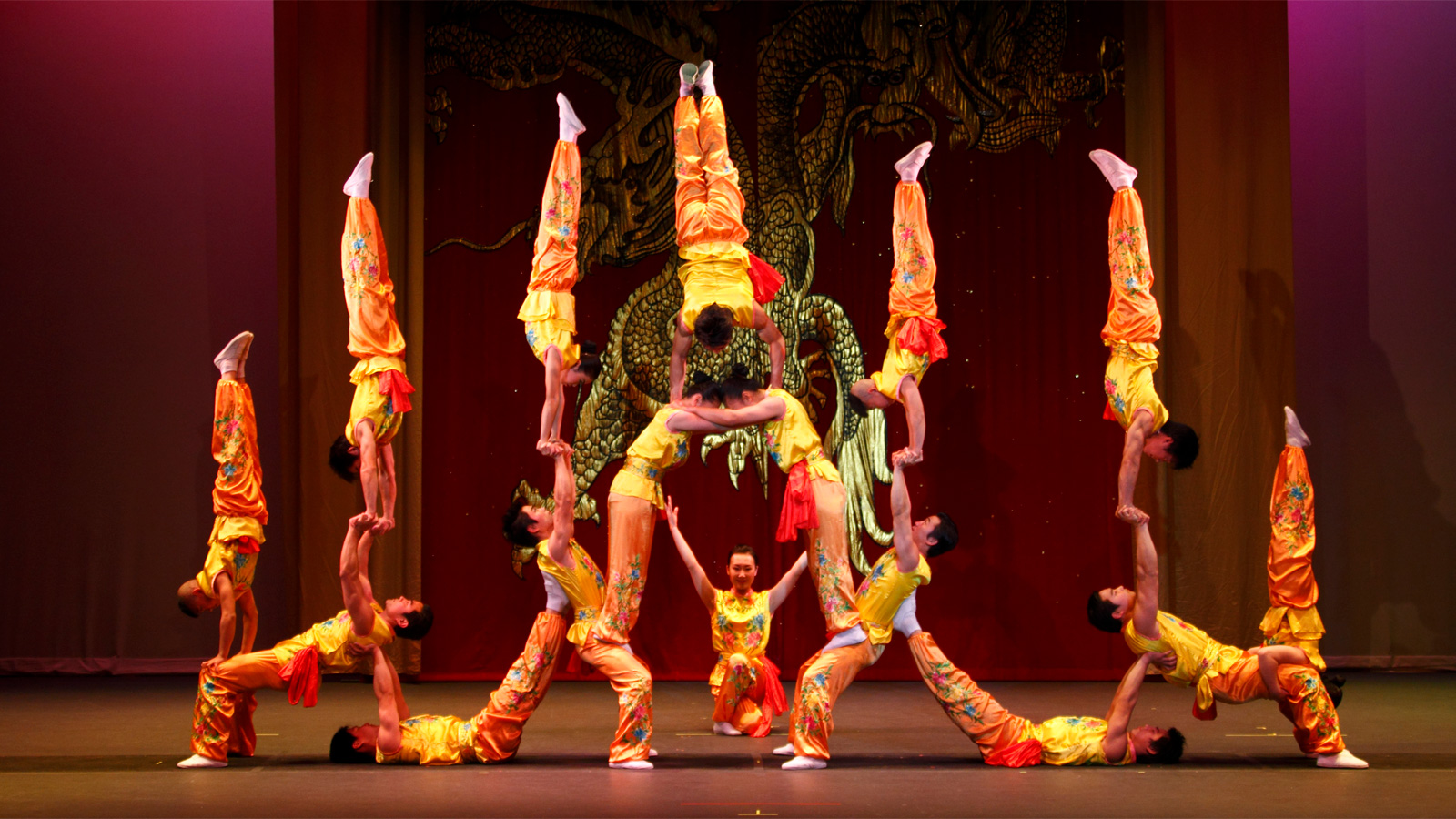 Acrobats balancing in formation.