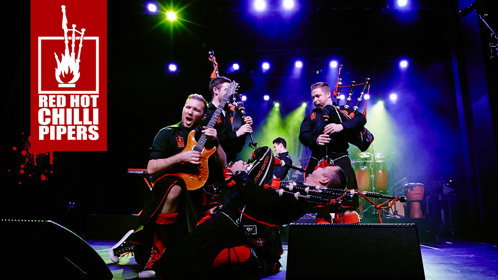 Red Hot Chilli Pipers: Rock bagpipers performing on stage.