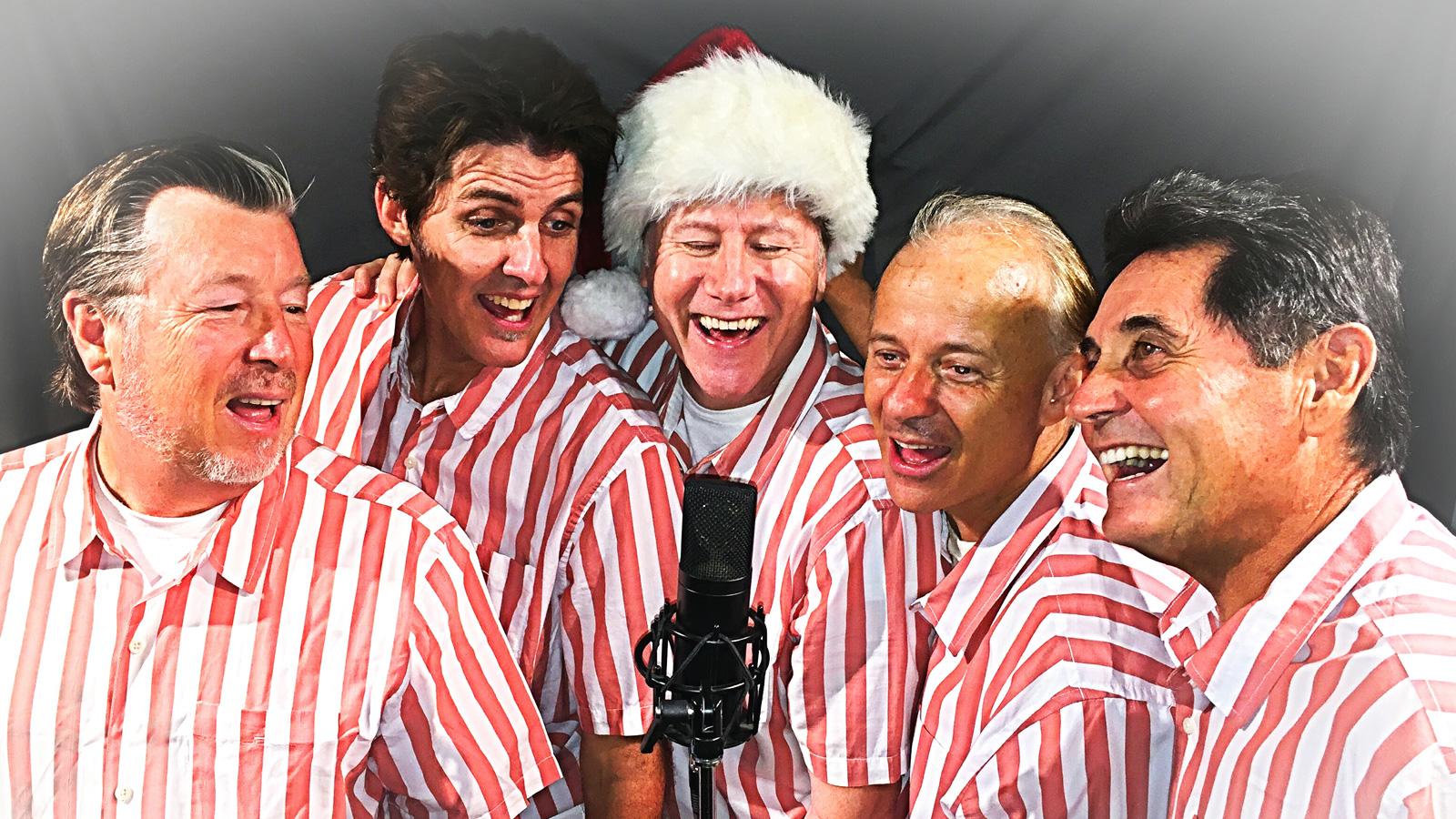 Members of Surfin' The Beach Boys Tribute dressed in holiday attire