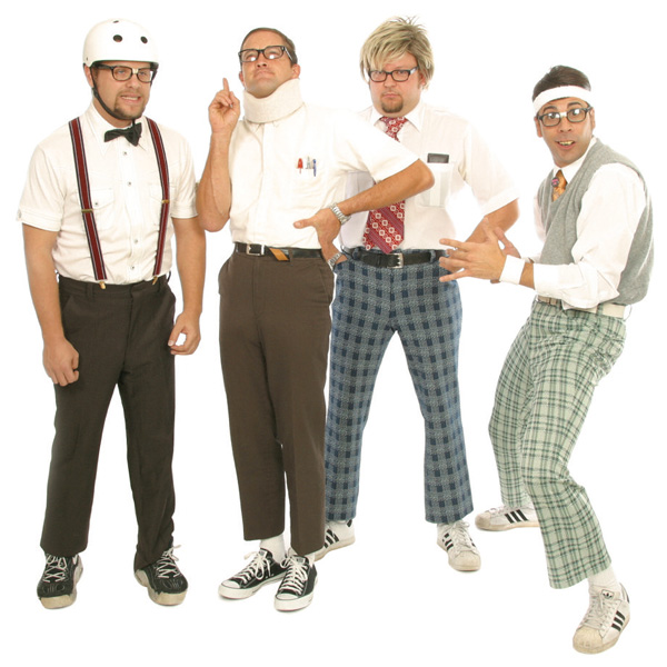 Members of the Spazmatics dressed in nerdy band attire.