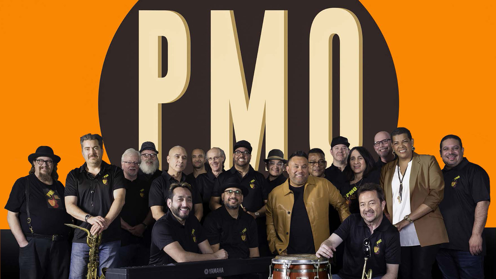 Members of the Pacific Mambo Orchestra under a PMO logo.