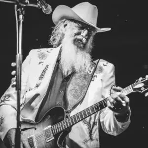 Ray Benson playing the guitar