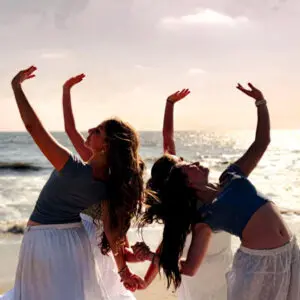 Flex dancers posing on the beach