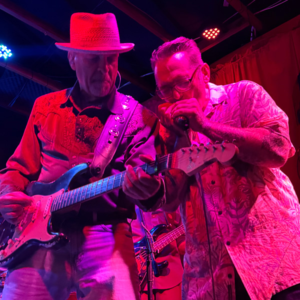 Burning James Blues Band playing guitar and harmonica